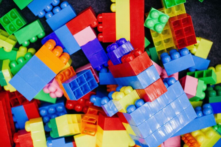Brightly colored plastic building blocks arranged in a playful pattern, perfect for children's activities.